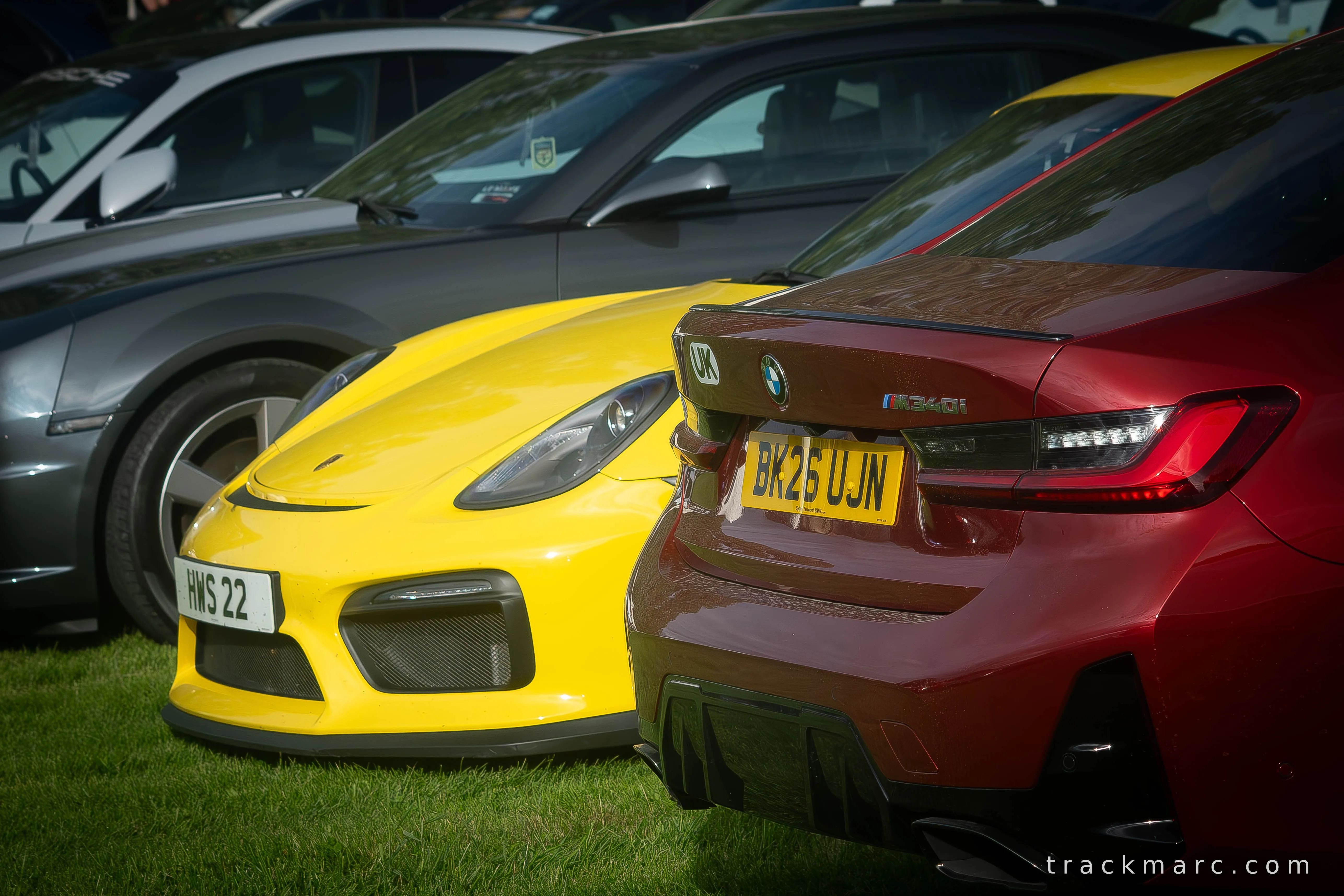 Porsche 718 Cayman GT4 and BMW M340i at Car Show