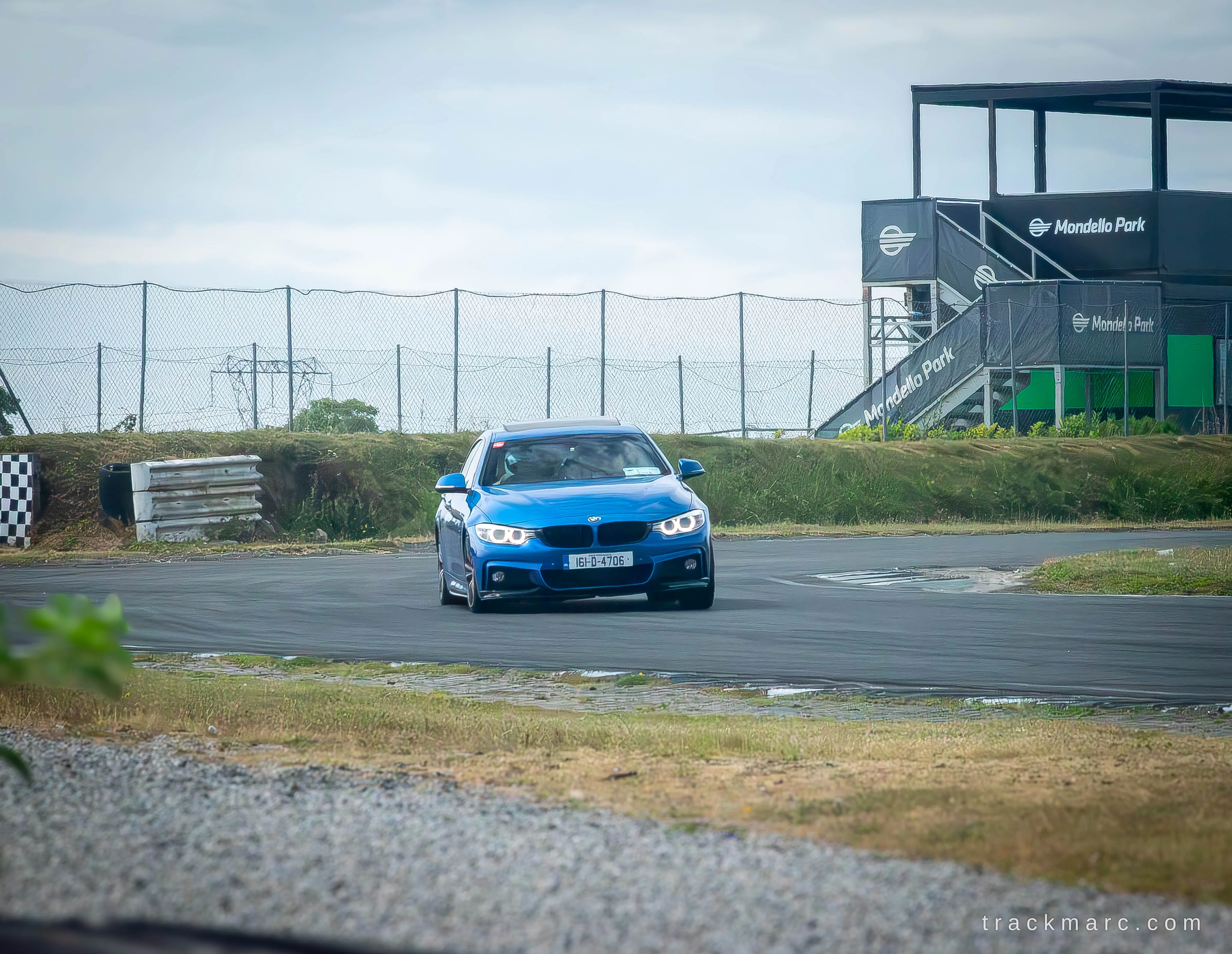 Blue BMW 3 Series on track