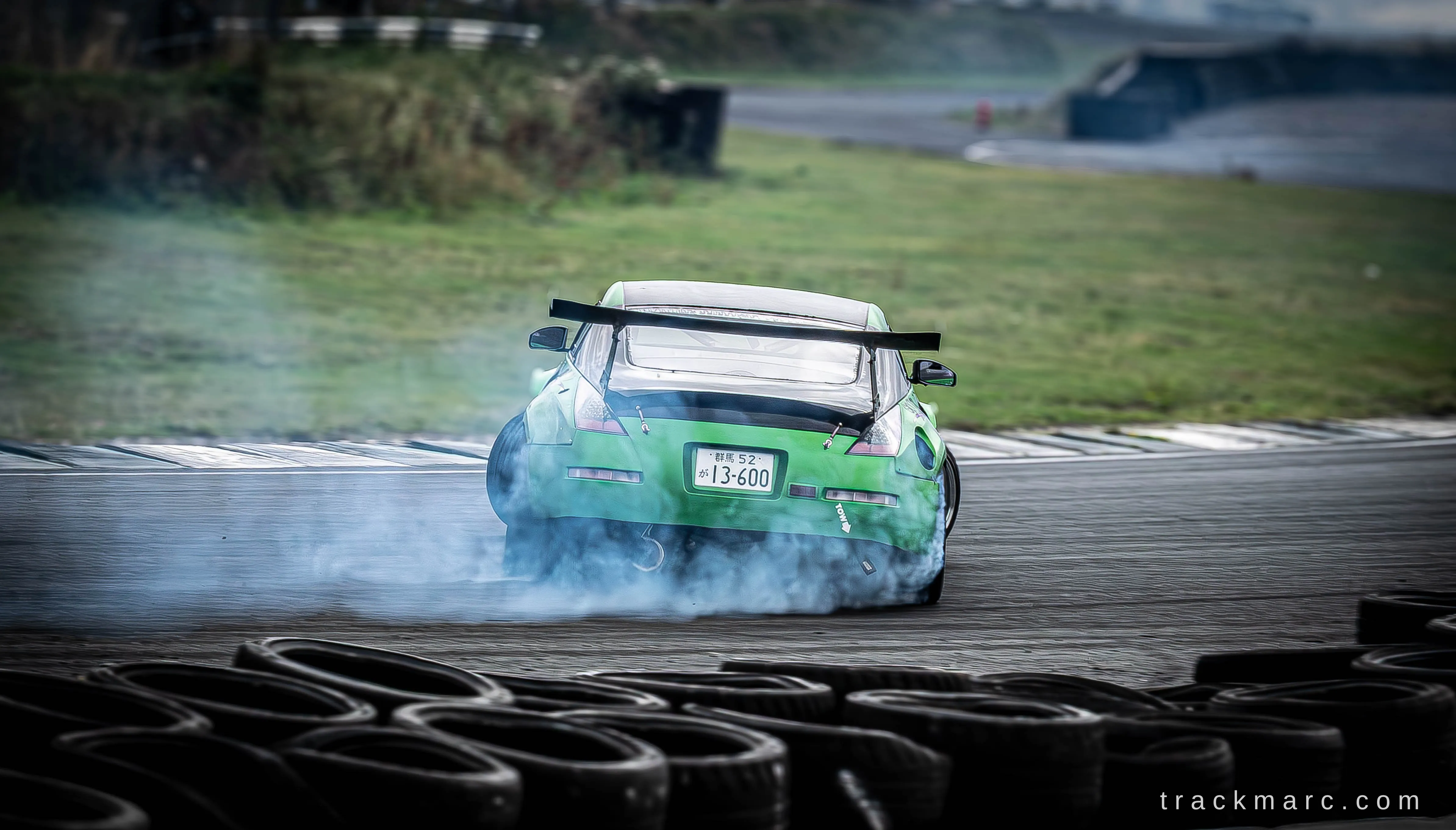 Green Nissan 350Z drifting at Drift Games