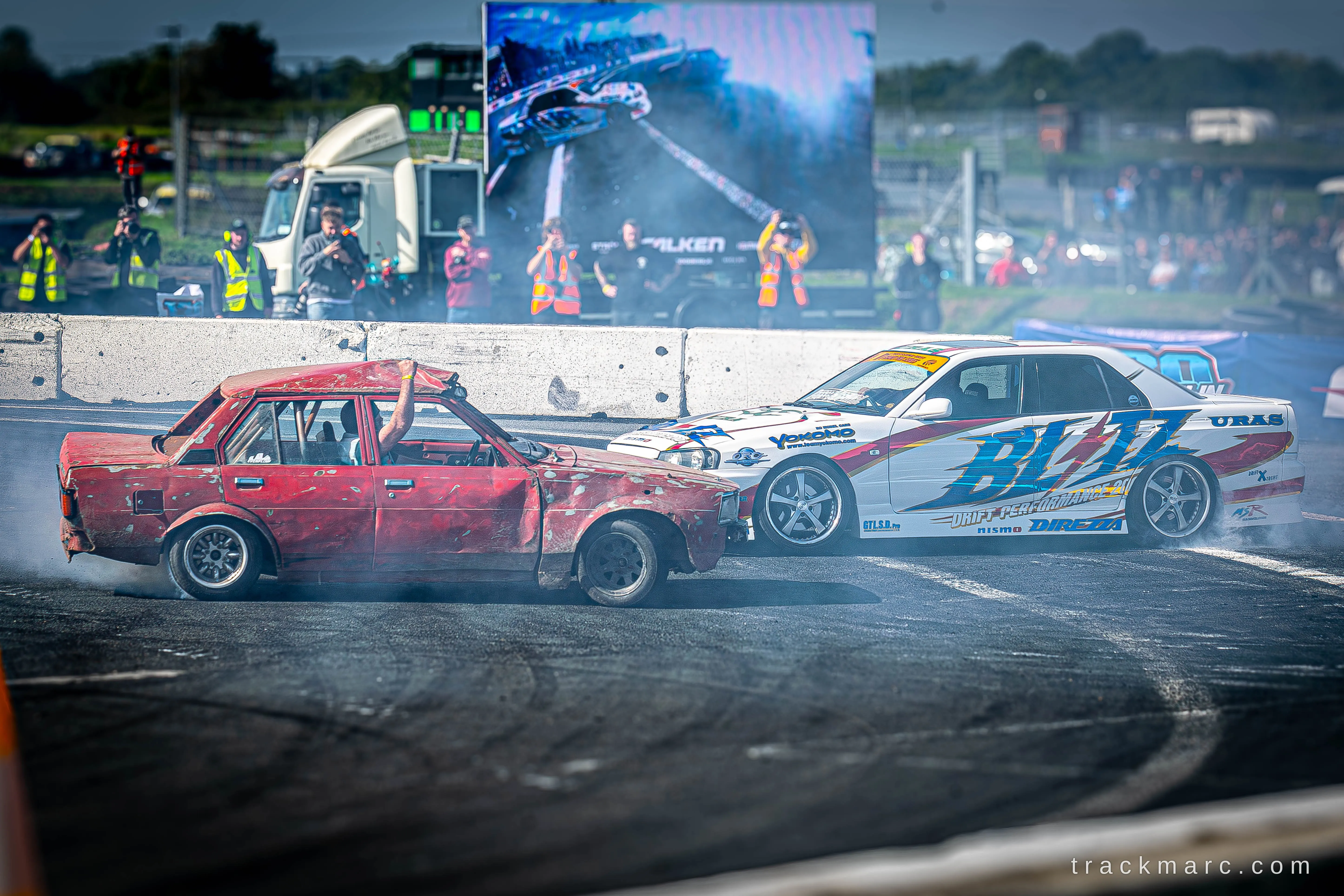 Battered saloon and Blitz-liveried Nissan Skyline, 130 Showdown